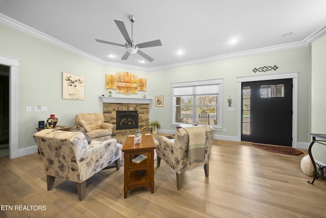 12 Edgemere Ct, Crossville, TN 38558 - living area featuring crown molding, baseboards, a fireplace, a ceiling fan, and light wood-type flooring