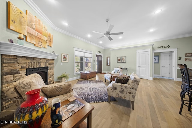 12 Edgemere Ct, Crossville, TN 38558 - living room with baseboards, ornamental molding, a fireplace, a ceiling fan, and light wood-style floors