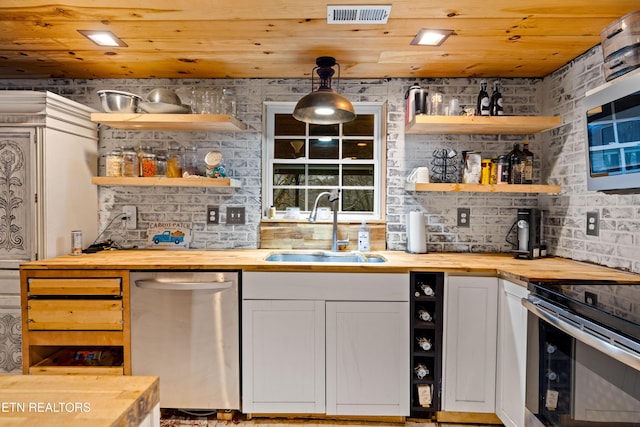 bar with pendant lighting, stainless steel appliances, visible vents, a sink, and wooden ceiling