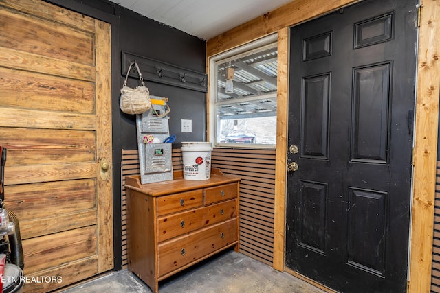 entryway featuring unfinished concrete floors