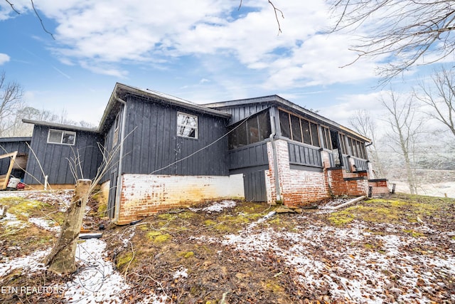 view of home's exterior featuring a sunroom