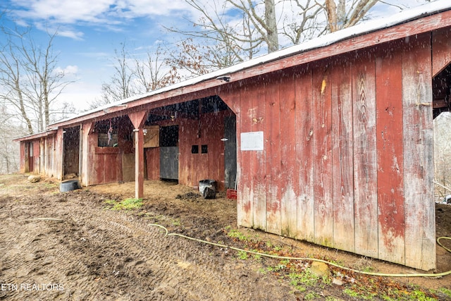 view of property exterior featuring an exterior structure and an outdoor structure