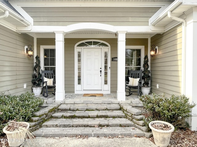 doorway to property with covered porch