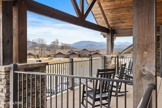 view of patio / terrace featuring a residential view and a mountain view