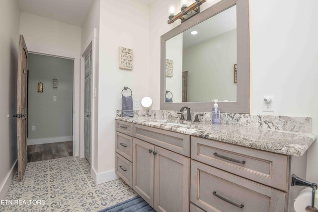 bathroom featuring vanity and baseboards