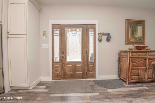 entryway with a wealth of natural light, baseboards, and dark wood-type flooring