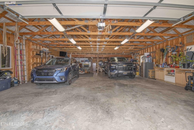 garage featuring a garage door opener