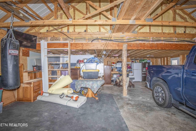 garage with freestanding refrigerator