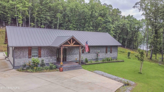 178 Emerald Pointe Cir, Rockwood, TN 37854 - view of front of home with a porch, a front lawn, a standing seam roof, and metal roof