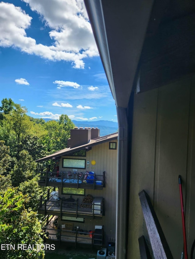 view of property exterior with a mountain view