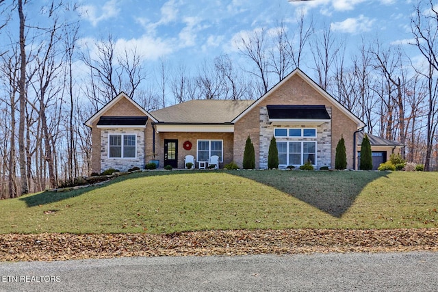 view of front facade featuring a front lawn and brick siding