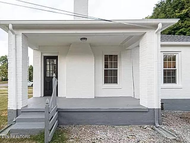 property entrance with a porch