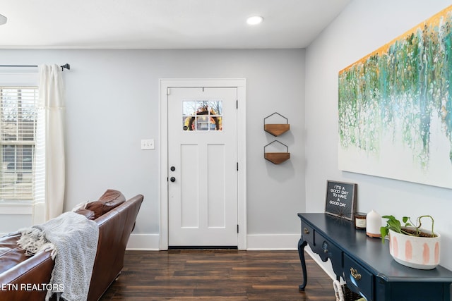 foyer entrance featuring recessed lighting, dark wood finished floors, and baseboards