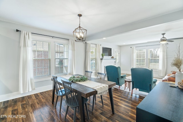 dining room with dark wood-style floors, recessed lighting, baseboards, and ceiling fan with notable chandelier