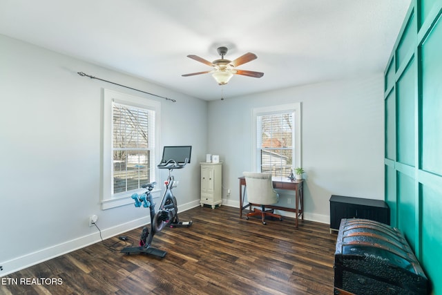 home office featuring baseboards, dark wood finished floors, and a healthy amount of sunlight