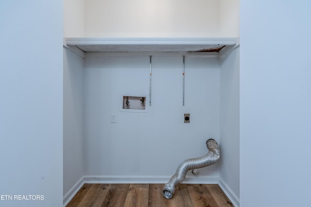 laundry area with baseboards, washer hookup, electric dryer hookup, and wood finished floors