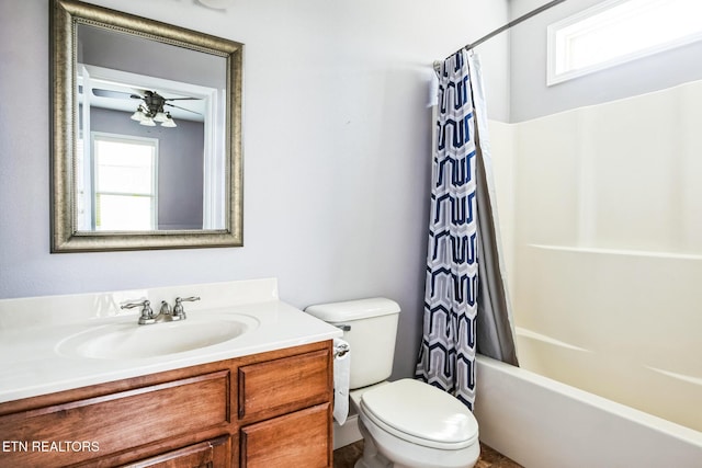 bathroom with shower / tub combo, vanity, and toilet