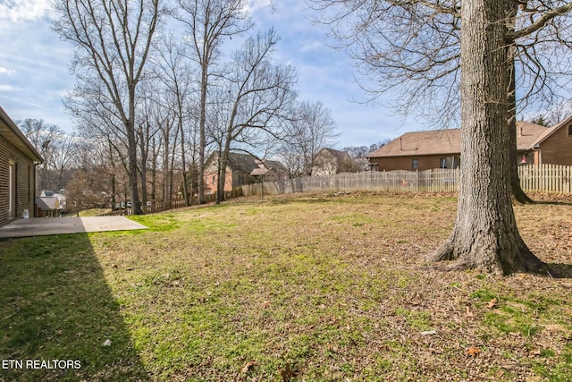 view of yard featuring a patio area and fence