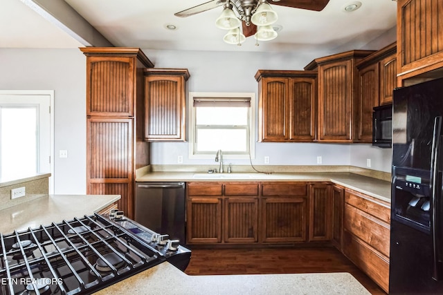 kitchen featuring ceiling fan, recessed lighting, a sink, light countertops, and black appliances