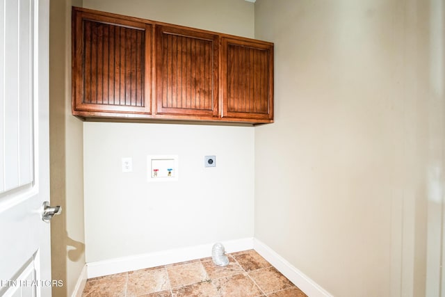 laundry room with cabinet space, baseboards, stone finish flooring, hookup for an electric dryer, and washer hookup