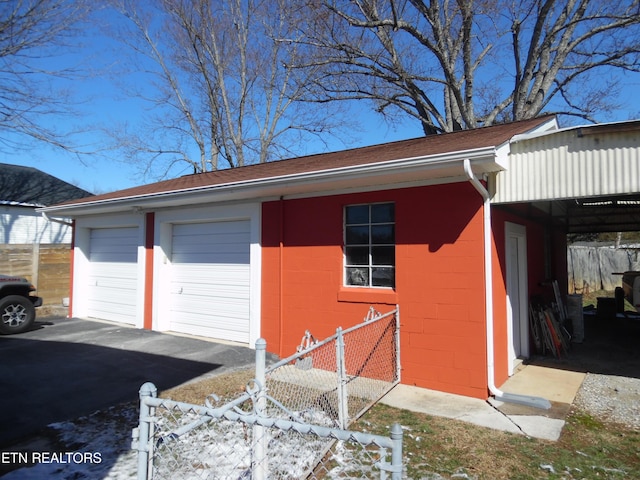 detached garage with fence