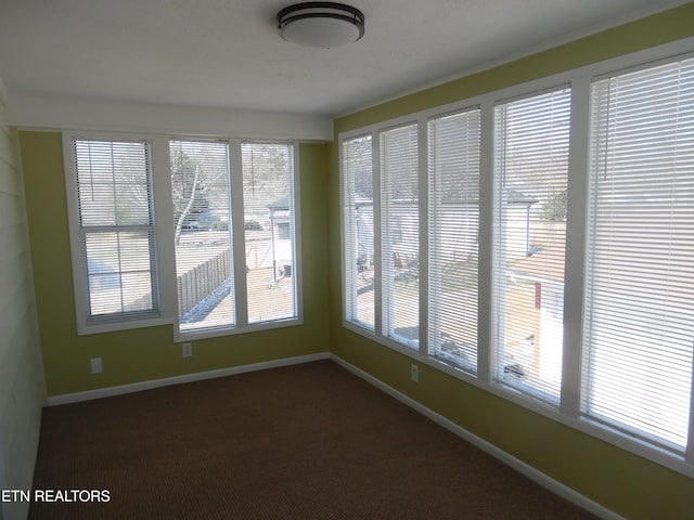 unfurnished sunroom featuring a healthy amount of sunlight