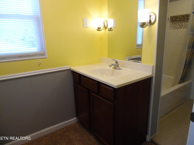 full bath with shower / bath combination with curtain, vanity, and baseboards