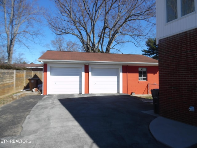 detached garage with fence