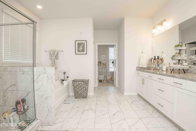 full bath with baseboards, marble finish floor, a garden tub, vanity, and recessed lighting