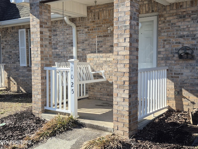 exterior space featuring brick siding