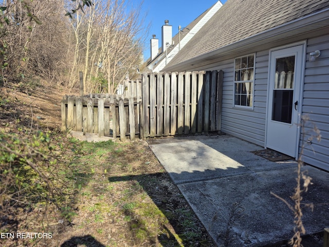 view of yard with fence and a patio