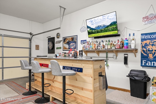 bar with a bar and baseboards