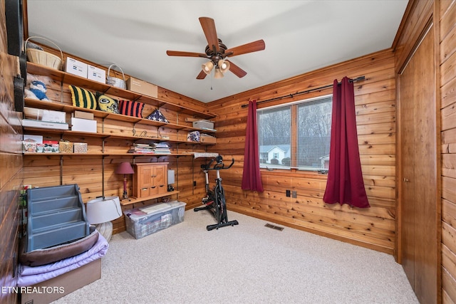 storage room with visible vents and a ceiling fan