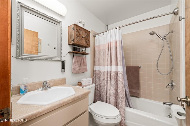 full bathroom featuring toilet, vanity, and shower / tub combo with curtain