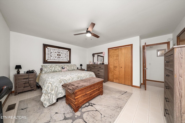 bedroom with a ceiling fan, a closet, and baseboards