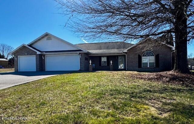 ranch-style house with a garage, concrete driveway, and a front lawn