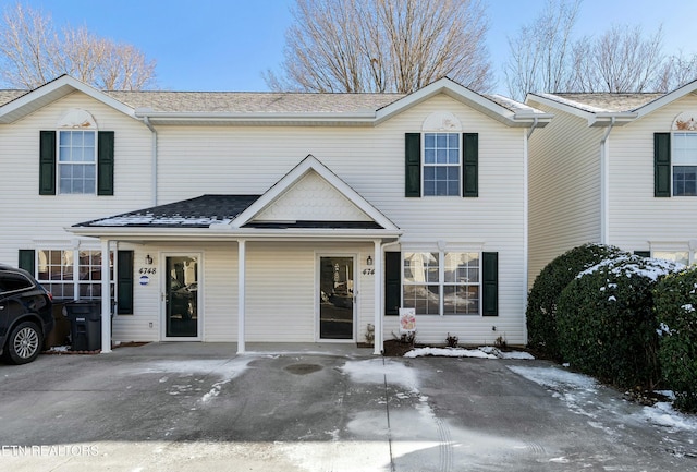 view of property with a shingled roof