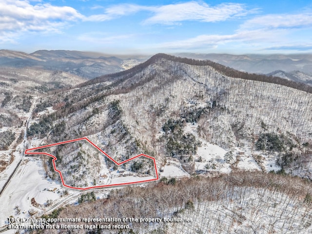 drone / aerial view featuring a mountain view