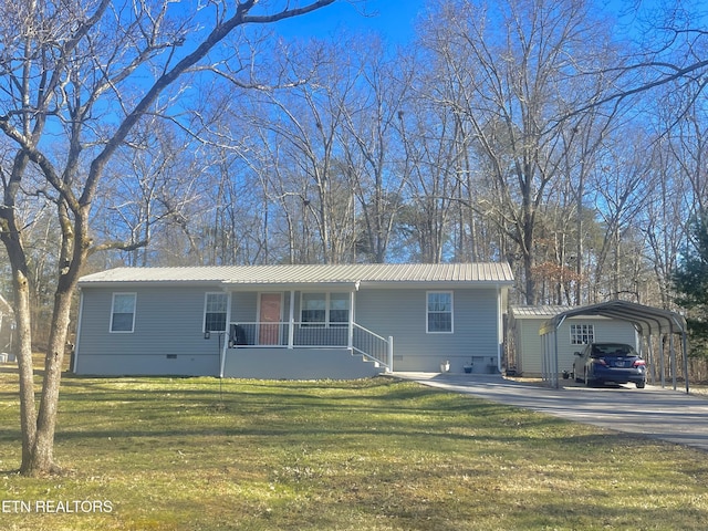 view of front facade with metal roof, a porch, crawl space, a carport, and a front yard