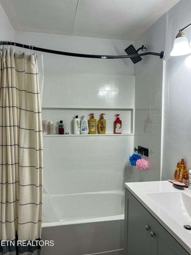 bathroom with shower / bath combo with shower curtain and vanity