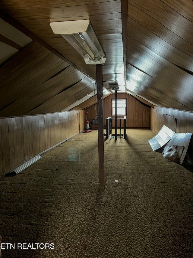 bonus room with lofted ceiling, wood walls, carpet, and wood ceiling