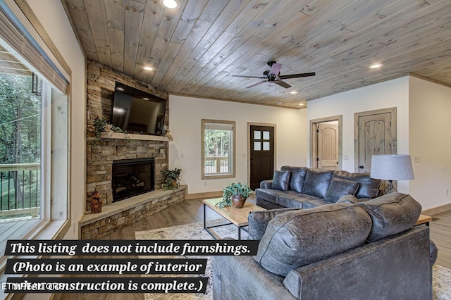 living room featuring recessed lighting, wood ceiling, a fireplace, and wood finished floors