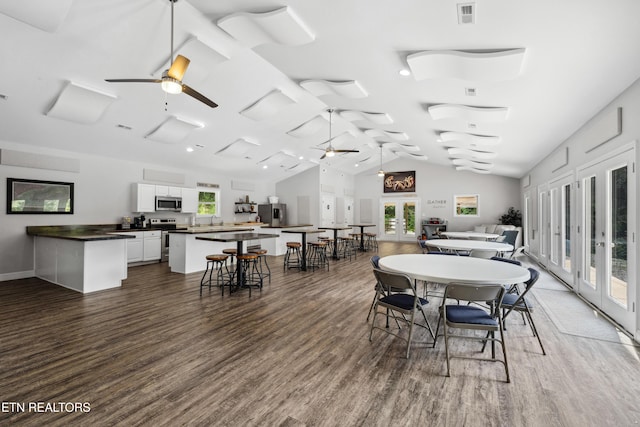 dining room with a ceiling fan, visible vents, a wealth of natural light, and french doors