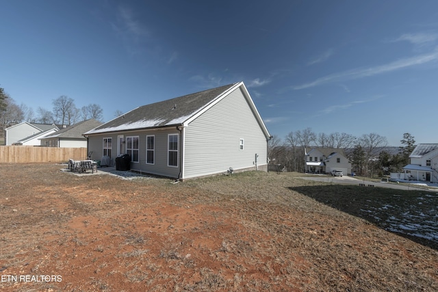 rear view of property with fence