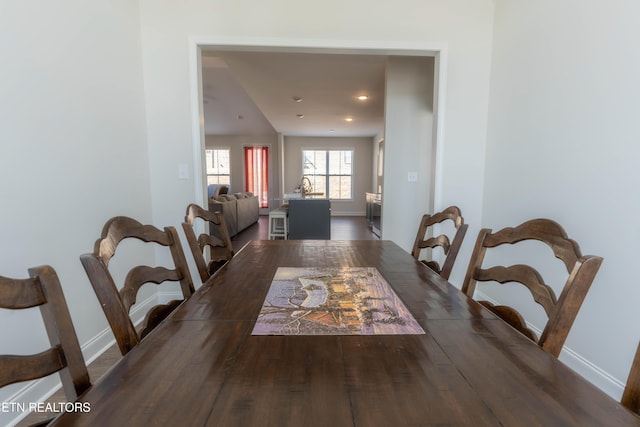 dining room featuring recessed lighting, wood finished floors, and baseboards