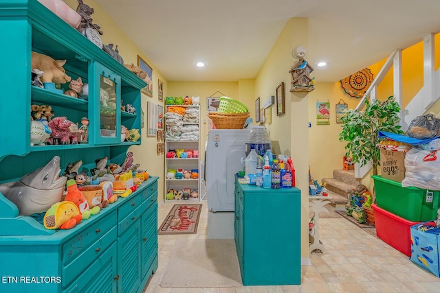 game room featuring washer / dryer and recessed lighting