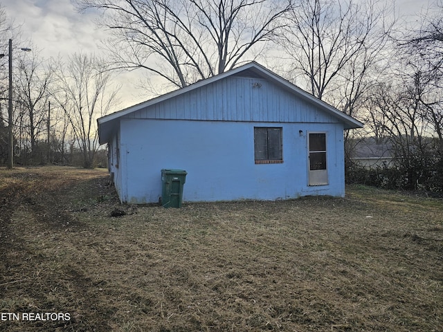 view of home's exterior with a lawn