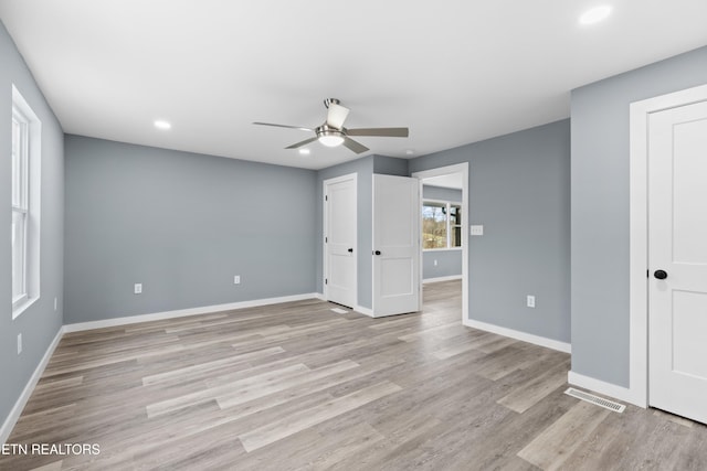 unfurnished bedroom with recessed lighting, visible vents, light wood finished floors, and baseboards