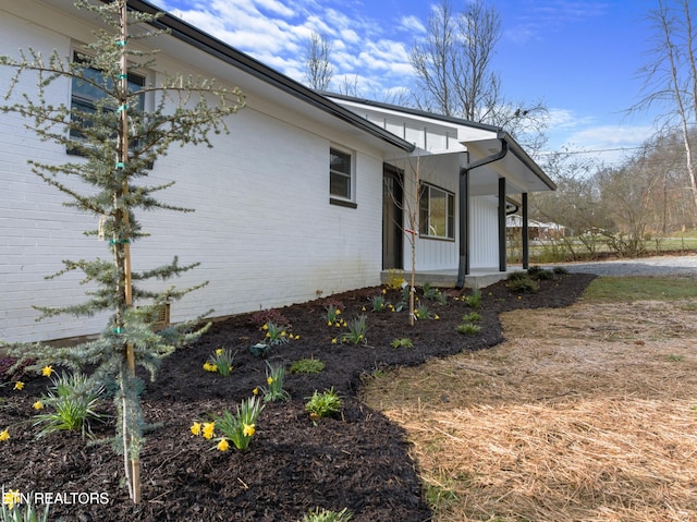 view of home's exterior with brick siding