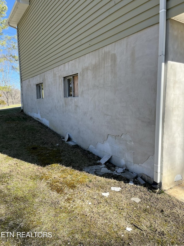 view of property exterior with stucco siding